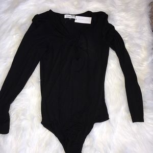 Black lace up body suit (tags still on)